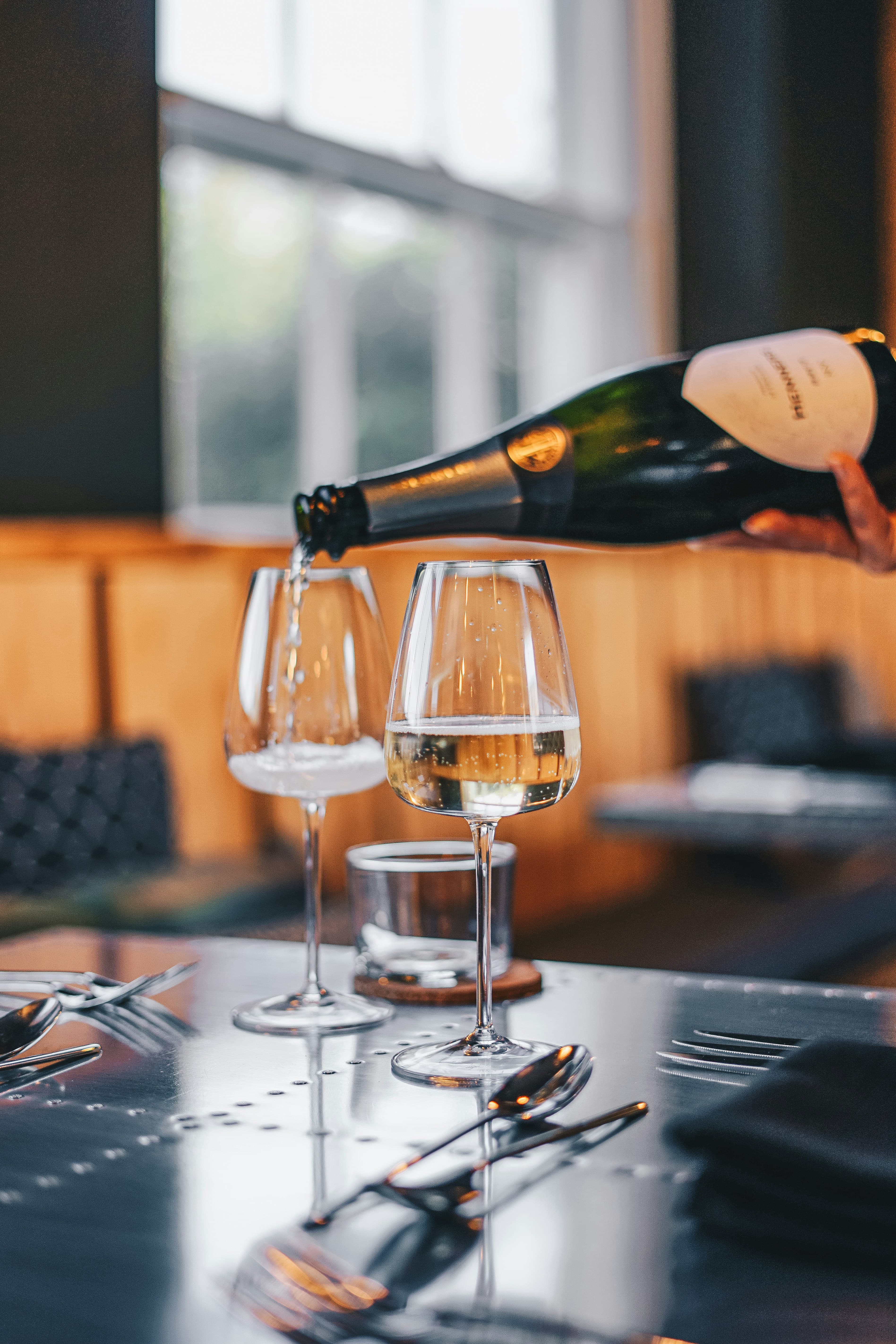 Wine being poured into glasses